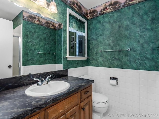 1044 Meadow Dr, Bartlesville, OK 74006 - bathroom featuring toilet, a stall shower, vanity, and tile patterned floors