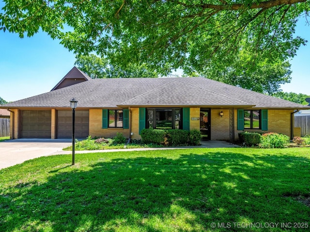 1044 Meadow Dr, Bartlesville, OK 74006 - view of front of property with a garage, concrete driveway, brick siding, and a shingled roof