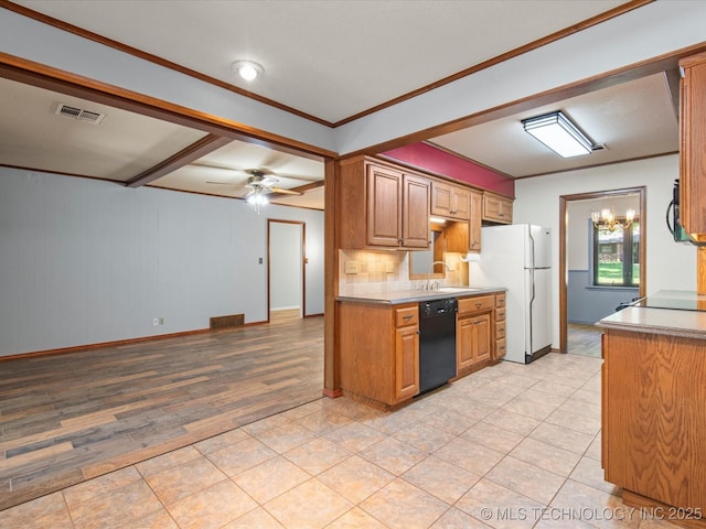 1044 Meadow Dr, Bartlesville, OK 74006 - kitchen with black appliances, baseboards, a sink, and a chandelier