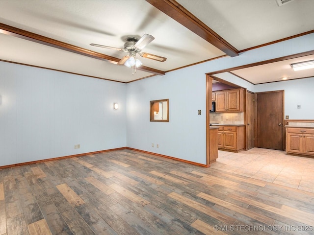 1044 Meadow Dr, Bartlesville, OK 74006 - unfurnished living room featuring light wood-type flooring, a ceiling fan, crown molding, and baseboards