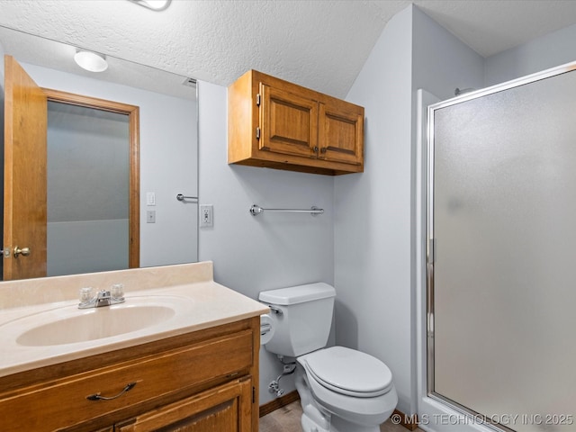 1044 Meadow Dr, Bartlesville, OK 74006 - full bathroom with a stall shower, toilet, vanity, and baseboards
