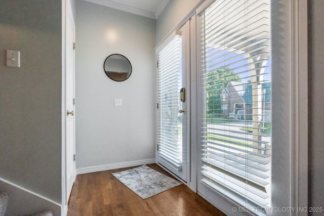 7646 S Fulton Ave, Tulsa, OK 74136 - doorway with ornamental molding, dark wood-style flooring, and baseboards