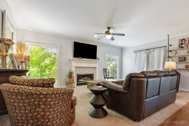 7646 S Fulton Ave, Tulsa, OK 74136 - living room featuring ceiling fan, carpet, a fireplace, and crown molding