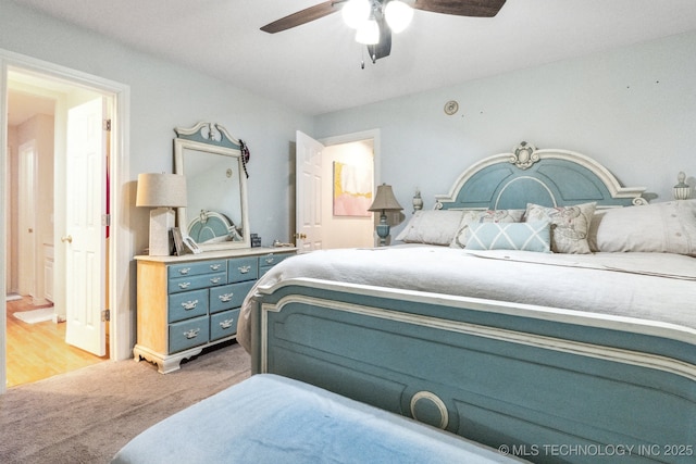 7646 S Fulton Ave, Tulsa, OK 74136 - bedroom with light colored carpet and ceiling fan