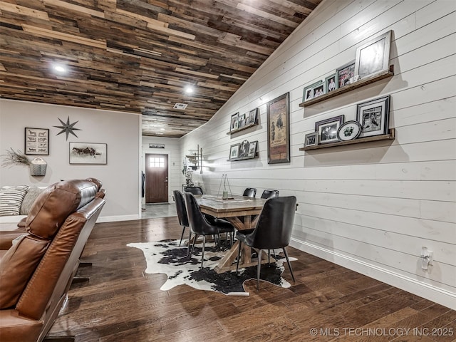 29550 S 4240th Rd, Inola, OK 74036 - dining area featuring baseboards, wooden walls, dark wood-type flooring, lofted ceiling, and wooden ceiling