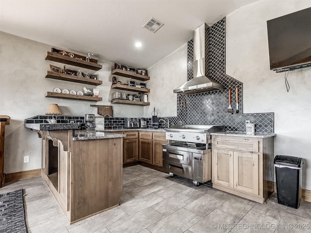 29550 S 4240th Rd, Inola, OK 74036 - kitchen with wall chimney range hood, a peninsula, open shelves, tasteful backsplash, and baseboards