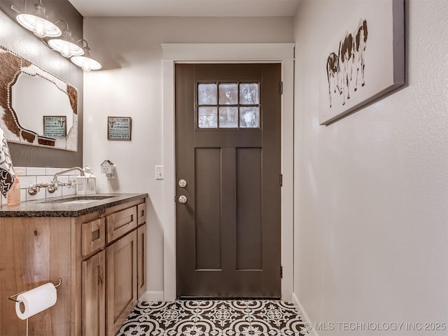 29550 S 4240th Rd, Inola, OK 74036 - doorway to outside with a sink, baseboards, and tile patterned floors