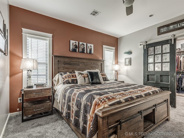 29550 S 4240th Rd, Inola, OK 74036 - bedroom featuring carpet floors, ceiling fan, a walk in closet, and baseboards