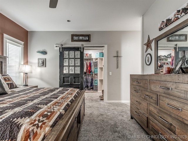 29550 S 4240th Rd, Inola, OK 74036 - carpeted bedroom featuring a walk in closet, a closet, ceiling fan, and baseboards