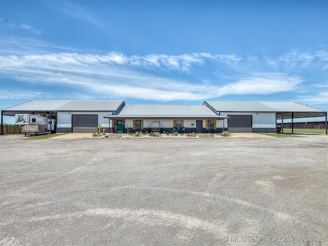 29550 S 4240th Rd, Inola, OK 74036 - view of front of house with dirt driveway, metal roof, and an attached garage