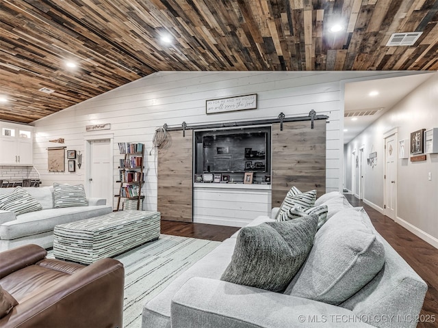 29550 S 4240th Rd, Inola, OK 74036 - living area with a barn door, wood finished floors, lofted ceiling, wood walls, and wooden ceiling