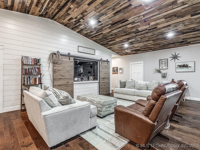 29550 S 4240th Rd, Inola, OK 74036 - living room featuring a barn door, wood walls, wood-type flooring, lofted ceiling, and baseboards