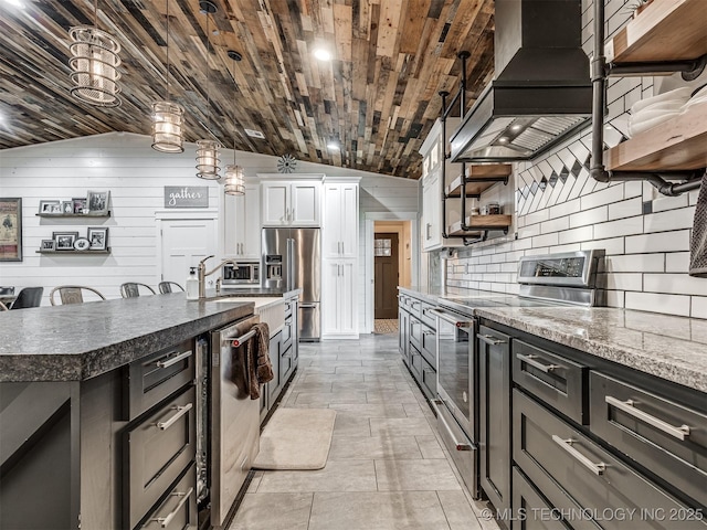 29550 S 4240th Rd, Inola, OK 74036 - kitchen with appliances with stainless steel finishes, custom exhaust hood, open shelves, lofted ceiling, and tasteful backsplash