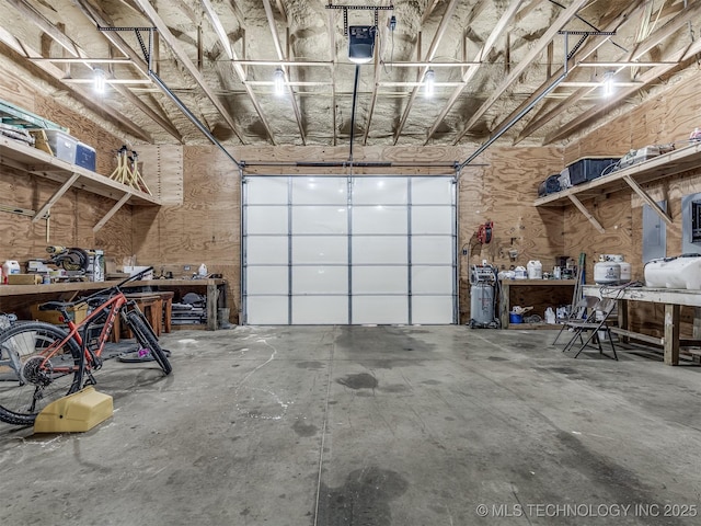 29550 S 4240th Rd, Inola, OK 74036 - garage featuring a workshop area and a garage door opener