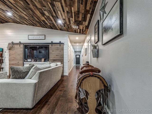 29550 S 4240th Rd, Inola, OK 74036 - living area with vaulted ceiling, a barn door, wood-type flooring, wooden walls, and recessed lighting