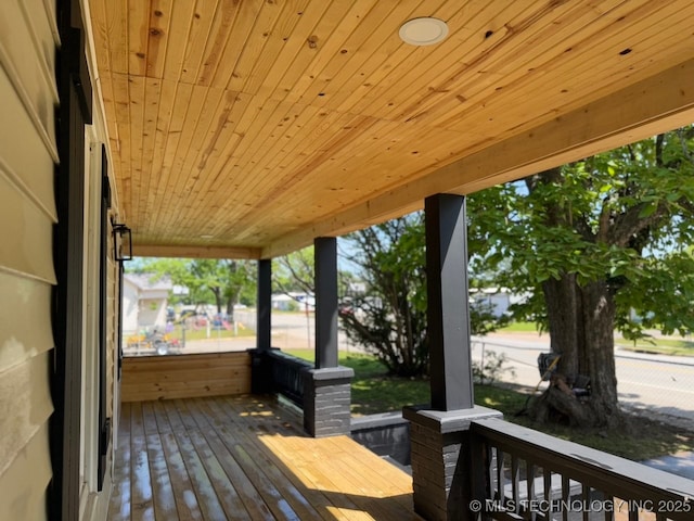 618 E Gentry Ave, Checotah, OK 74426 - deck with a porch