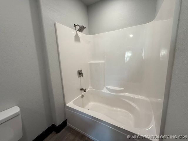 618 E Gentry Ave, Checotah, OK 74426 - full bath featuring toilet, bathing tub / shower combination, and wood finished floors