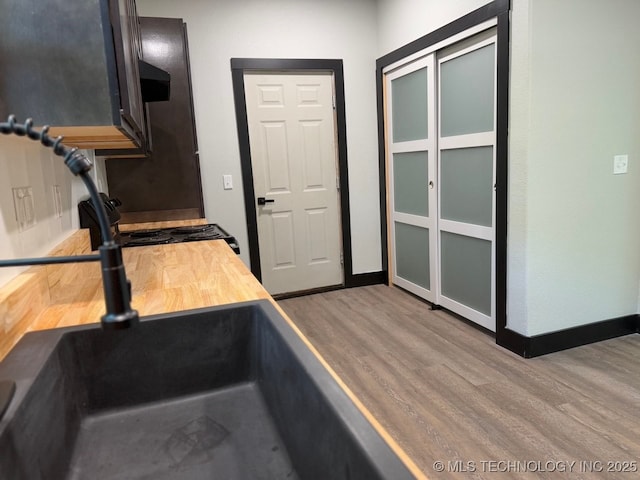 618 E Gentry Ave, Checotah, OK 74426 - stairway with wood finished floors and baseboards