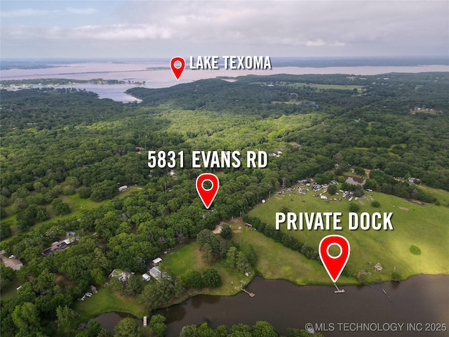 5831 Evans, Kingston, OK 73439 - aerial overview of property's location featuring a heavily wooded area and a large body of water