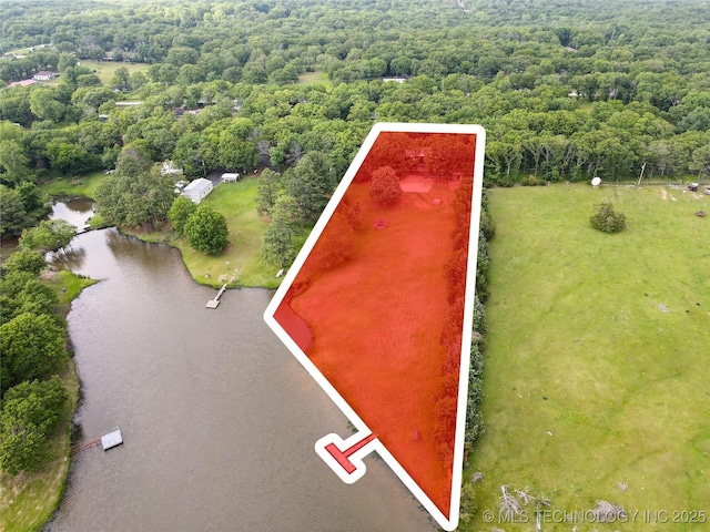 5831 Evans, Kingston, OK 73439 - aerial view of property's location featuring a large body of water, a forest, and property parcel outlined