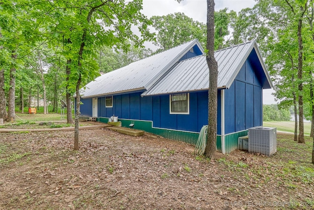 5831 Evans, Kingston, OK 73439 - view of side of property featuring cooling unit and metal roof