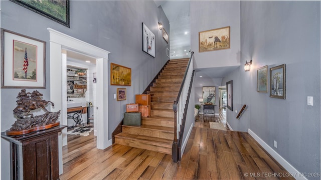 30230 S 562, Afton, OK 74331 - staircase with a towering ceiling, wood finished floors, and baseboards