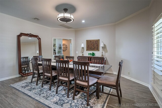 8212 S Delaware Pl, Tulsa, OK 74137 - dining space featuring ornamental molding, dark wood finished floors, and baseboards