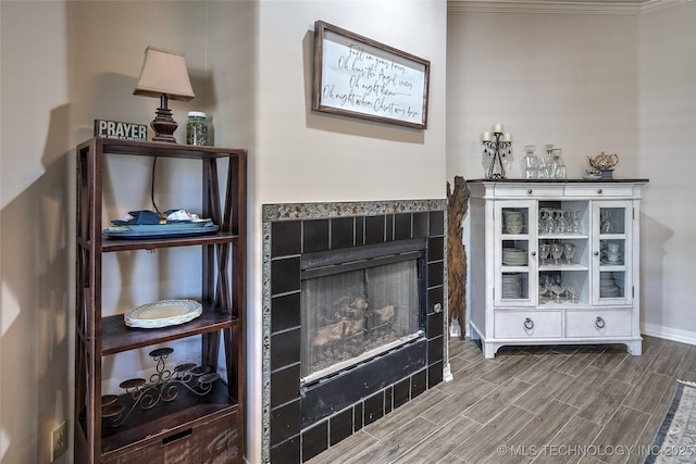 8212 S Delaware Pl, Tulsa, OK 74137 - living area with a fireplace, wood finished floors, and baseboards
