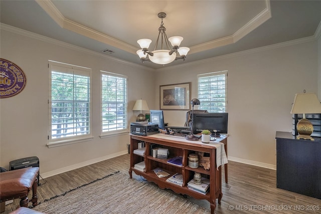 8212 S Delaware Pl, Tulsa, OK 74137 - office with a raised ceiling, healthy amount of natural light, wood finished floors, a chandelier, and crown molding