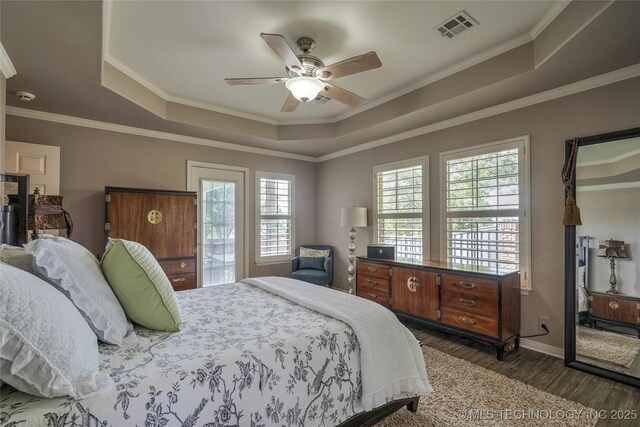 8212 S Delaware Pl, Tulsa, OK 74137 - bedroom with a raised ceiling, dark wood-style flooring, ornamental molding, baseboards, and a ceiling fan