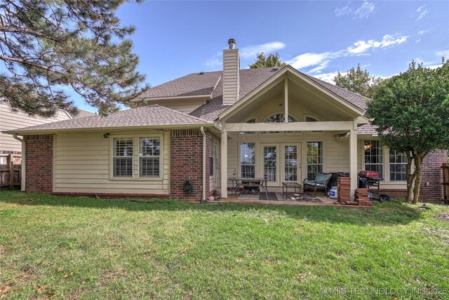 8212 S Delaware Pl, Tulsa, OK 74137 - rear view of property with brick siding, a patio, roof with shingles, and a chimney