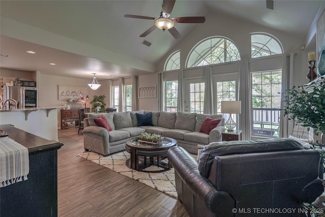 8212 S Delaware Pl, Tulsa, OK 74137 - living area with light wood-style floors, a ceiling fan, high vaulted ceiling, and recessed lighting