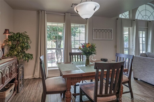 8212 S Delaware Pl, Tulsa, OK 74137 - dining room with plenty of natural light, wood finished floors, and baseboards