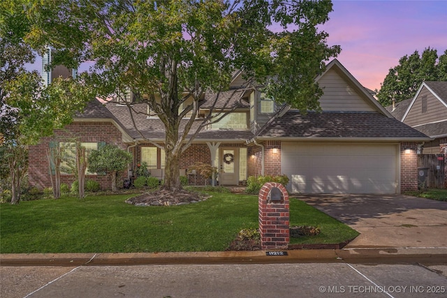 8212 S Delaware Pl, Tulsa, OK 74137 - view of front of property featuring a garage, brick siding, driveway, and a front yard