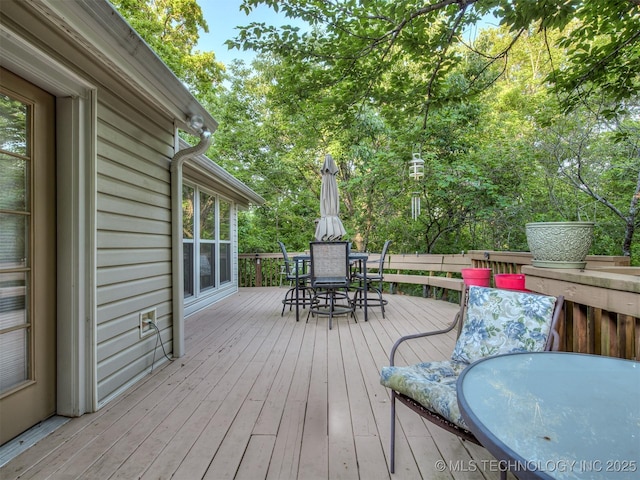 deck with outdoor dining area