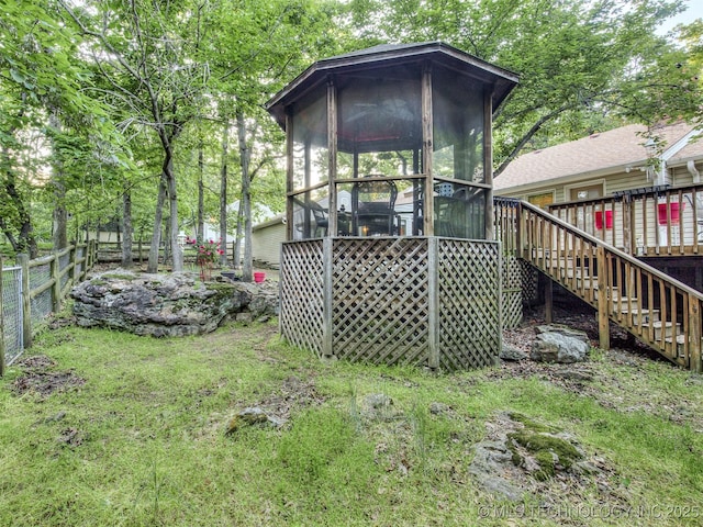 view of outdoor structure with a sunroom and stairs