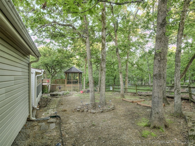 view of yard with a gazebo and fence
