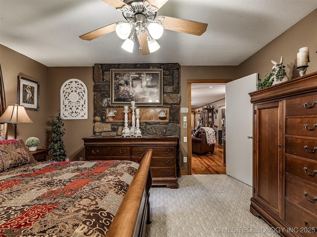 carpeted bedroom featuring a ceiling fan