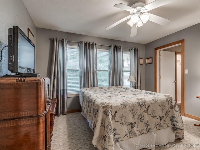 bedroom with carpet, baseboards, and ceiling fan