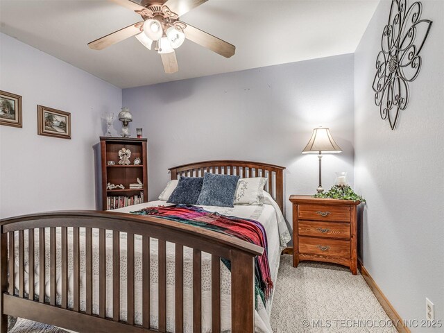 bedroom with carpet floors, baseboards, and a ceiling fan