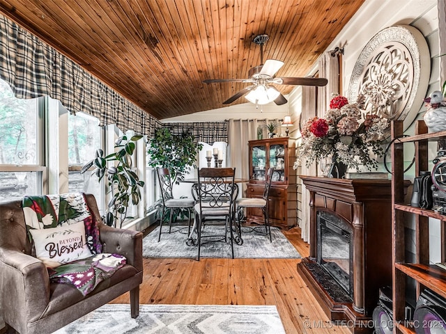 sunroom / solarium featuring vaulted ceiling