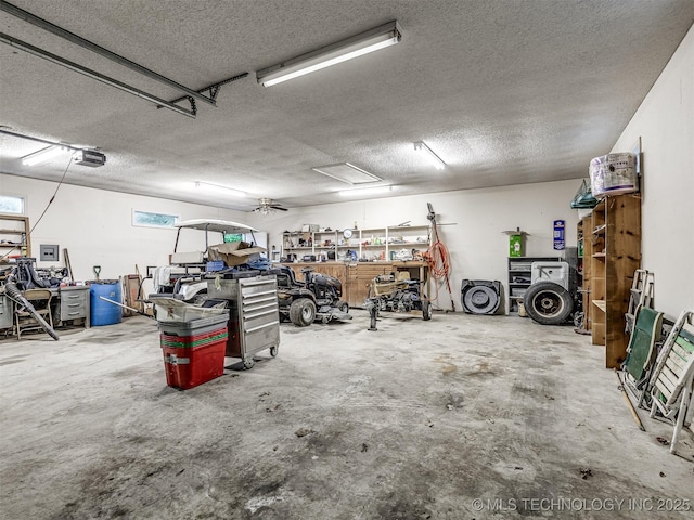 garage featuring a garage door opener and a workshop area