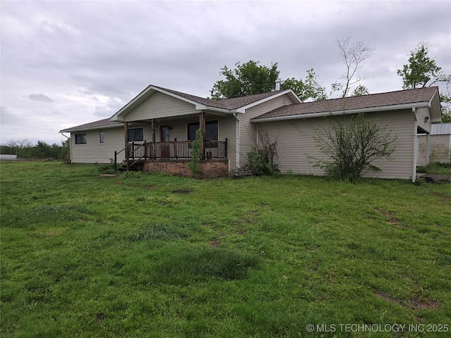 view of front of house with covered porch and a front yard