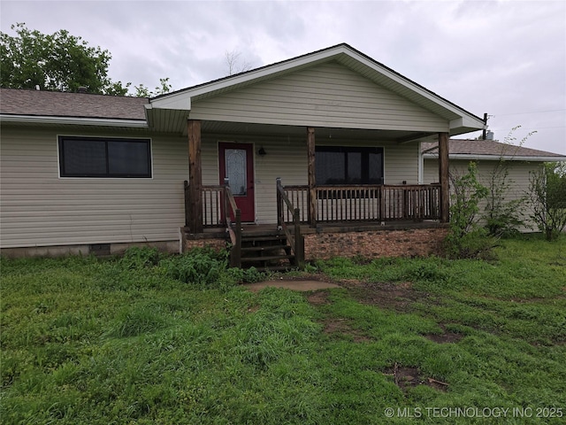 view of front of home featuring covered porch and roof with shingles
