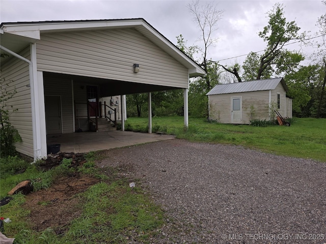 view of car parking featuring driveway and entry steps