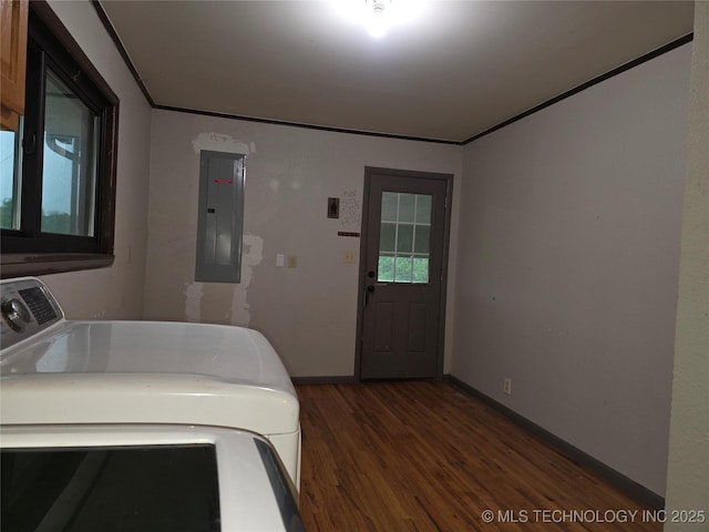 laundry room featuring electric panel, washer / clothes dryer, wood finished floors, and baseboards