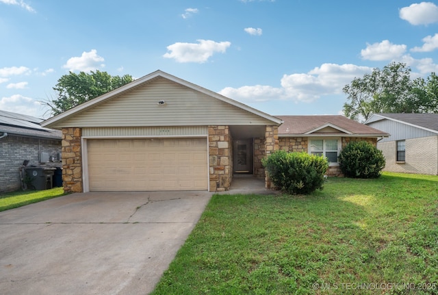 2925 S 125th E Ave, Tulsa, OK 74129 - view of front of home featuring stone siding, an attached garage, driveway, and a front yard
