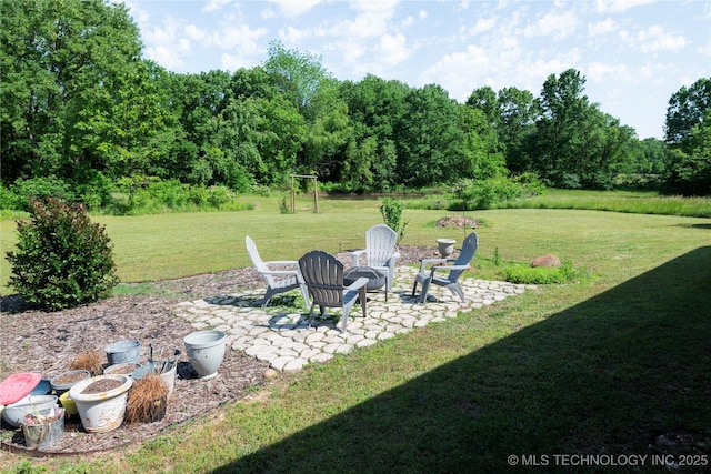 72413 S 4750th Rd, Westville, OK 74965 - view of grassy yard featuring a patio area and an outdoor fire pit
