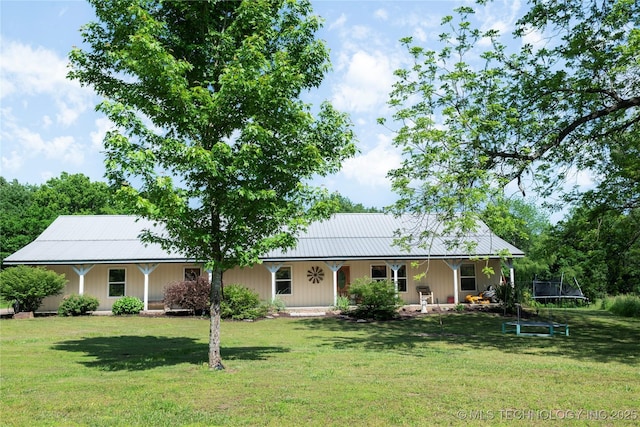 72413 S 4750th Rd, Westville, OK 74965 - view of front facade with a trampoline, a front lawn, a porch, and metal roof