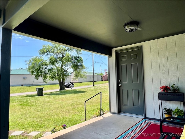 205 NE 1st St, Kingston, OK 73439 - doorway to property with a yard